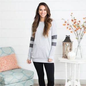 Light gray pullover.